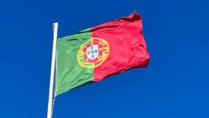 Portugal flag waving blue sky background 1