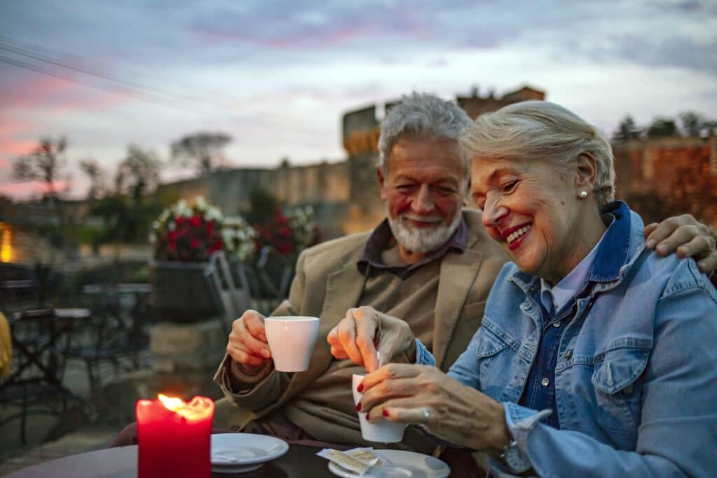 Senior couple at cafe in the evening in Portugal
