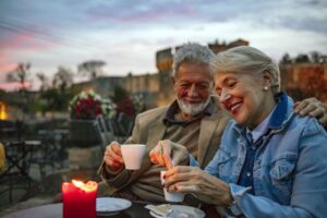 Senior couple at cafe in the evening in Portugal